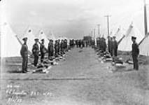 Personnel awaiting kit inspection at summer camp of No.111(CAC) Squadron, R.C.A.F. 9 June 1939