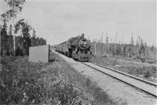 The local freight passing the Frontier College speeder house at unidentified location. Aug. 1927