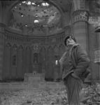 General Sir Bernard L. Montgomery, standing in nave of ruined church. 13 Dec. 1943