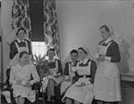 Nursing sisters having tea - Royal Canadian Naval Hospital. St. John's, NFLD, April 1943. Apr. 1943