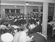 Carol singing by nursing sisters at Royal Canadian Naval Hospital. St. John's, NFLD, 21 Dec. 1944. 21 DEC. 1944