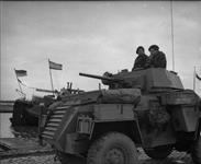 Personnel in Humber Mk.IV scout car of the 14th Canadian Hussars waiting to cross to North Beveland Island. (L-R): Sgt. A. Mercey, Tpr. E. Boland. 1 Nov. 1944