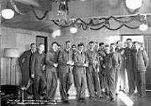A group of officers in the Officer¿s Mess on Christmas Day, Royal Canadian Air Force Station Coal Harbour, British Columbia, Canada, 25 December 1941. December 25, 1941.