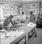 Inuit printmakers at work in the Art Centre, Cape Dorset, N.W.T., [Cape Dorset (Kinngait), Nunavut]  September 27, 1960.