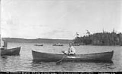 Mr. Judd as water patrol, Ernescliffe Regatta, Rosseau Lake, Muskoka Lakes. ca. 1908