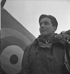 Unidentified pilot with Hawker 'Hurricane' XII aircraft of No.129 Squadron, R.C.A.F. May 1943