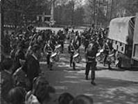 The Bugle Band of the Royal Canadian Regiment after the liberation of the city by the 1 Cdn Division. 17 Apr. 1945
