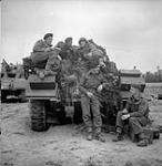 Troopers of the 18th Armoured Car Regiment (12th Manitoba Dragoons) with a T-17 E1 Staghound 4X4 near Caen, France, 19 July 1944  July 19, 1944.