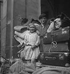 Bombed out children with their belongings. 10-Jul-44