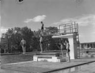 A swimming pool which has been taken over by the Canadian Army Occupation Force (C.A.O.F.), Aurich, Germany, ca. 26-27 August 1945. [ca. August 26-27, 1945].