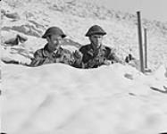 Personnel of the Royal 22e Regiment in a front-line position. (L-R): Privates A.F. Proulx, J.M. Aubin. Dec. 1952