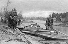 "Loading Jumbo": members of the Buckskin Club loading a large river scow with supplies for a hunting trip. 1892