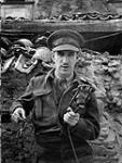 War correspondent Benoit Lafleur of the Canadian Broadcasting Corporation near San Vito Chietino, Italy, 8 April 1944 Apri1 8, 1944.