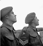 Unidentified paratroopers, one of whom is a sergeant, of the 1st Canadian Parachute Battalion, visiting Stonehenge, Salisbury Plain, England, 19 May 1944. May 19, 1944.