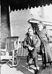 Photograph about the history of Black people in Ontario. Judah Philip and wife Henrietta on porch  ca. 1915