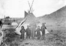 [Kainai Nation family on Crow's Nest Pass Line Railway near the St. Mary River.]  ca. 1897-1898.