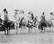 Blackfoot warriors on horseback. 1907