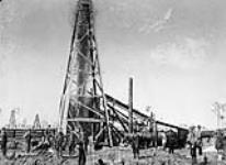 Exploding a torpedo in an oil well at Petrolia [Ont.]. 1886