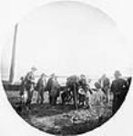 Town Council Taking It In [Group of Haida Indian Inspecting Camera]. ca. 1890