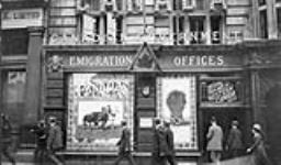 Messrs. Krag & Dawson entering Canadian Emigration Offices, 11-12 Charing Cross, London, England. July, 1911. July 1911