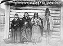 Chief St. Paul posing with his wife and two daughters 1865