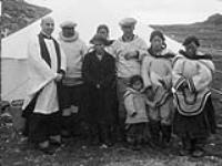 Canon H.S. Shepherd with an Inuit wedding group. 1945