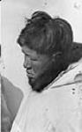 Inuit man wearing a white parka. ca. 1945-1946