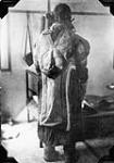 Unmarried Inuit girl wearing an artikee [graphic material] : 1929.