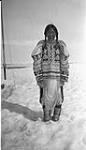 [Smiling Inuk woman in a beaded amauti]. Original title: Smiling Inuit woman in a decorated amauti   [between 1926-1943].