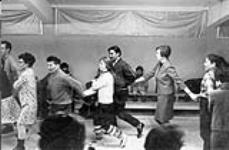 Terry, Peter Pitseolak, Pat, Kananginak, Elli and Tommy at the Friday night dance [graphic material]. Apr. 1968