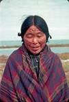 Inuit woman [Kadluk] with facial tattoos and braids. 1937.