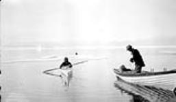 [Mr. Gaul, a Hudson's Bay Company factor, with an Inuk man named Ak-ah-Malah who is in a kayak] Original title: Mr. Gaul, Hudson's Bay factor, and native Ak-ah-malah. 1927