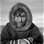 [Artist Kiakshuk wearing a hooded coat, Kinngait, Nunavut]. [between 1956-1960]