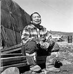 [Inuksiak sitting and smiling, Iqaluit, Nunavut]. [between 1956-1960]