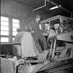 [Two men on a bulldozer]. [between 1956-1960]