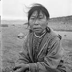 [Sheouak Petaulassie posing outdoors, Kinngait, Nunavut]. [between 1956-1960]