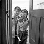 [Two Girl Guides, [Kootoo Watsco (left) and Lucy Evaluardjuk](right) selling raffle tickets, Iqaluit, Nunavut]  1960