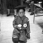 [Brownie holding a cup, Iqaluit, Nunavut]. 1960