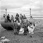 [Unloading supplies from a cargo boat, Iqaluit, Nunavut]. 1960