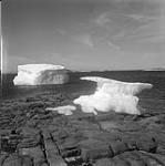 [Large chunks of ice near "Spyglassie Island" in Frobisher Bay, Iqaluit, Nunavut]. 1960