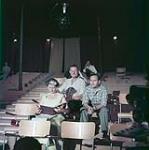 From left to right, [Elspeth Cochrane, stage manager],Tyrone Guthrie (L) and Cecil Clarke (R)  during Richard III presented at Stratford Shakespeare Festival, Stratford, Ontario  July 1953