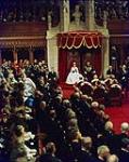 Her Majesty Queen Elizabeth II opens Canada's 23rd Parliament in the Senate Chamber, Ottawa, Ontario 14 October 1957.