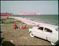 Beach at Percé on Quebec's Gaspé Peninsula. In background is the Percé Rock.  July 1950.