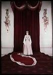 H.M. Queen Elizabeth II in throne room of Buckingham Palace.  [1950].
