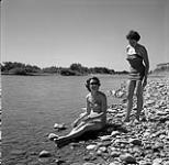 Audrey James and Anna Brown by the Oldman River, Alberta  August 11, 1954.