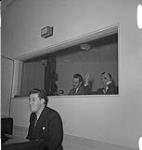 Happy Gang Studio Recording, Sept. 1941, producer giving thumbs up in control room . September, 1941