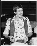 Garfield French of the band Garfield (possibly standing next to a boxing ring)  [between 1976-1979].