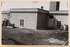 [Pump and engine room from outside, St. Cyprian¿s Indian Residential School, Brocket, Alberta, March 21, 1945]