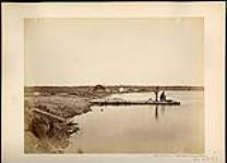 Two men fishing off a dock at Steamboat Pier, Northwest Angle, Lake of the Woods, Ontario  October 1872.