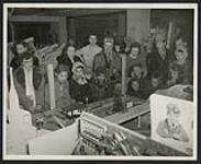 [A crowd watching an electric train, Regina, Saskatchewan, 1950s]. ca. 1950